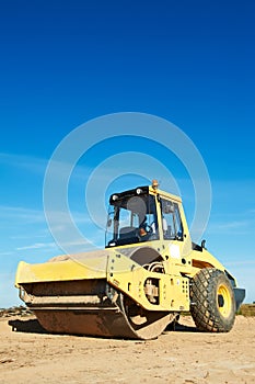 Compactor at road compaction works photo