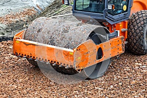 Compactor with vibratory padfoot drum working