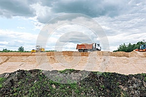 Compactor and vibratory roller machine working on road construction site. drone photography