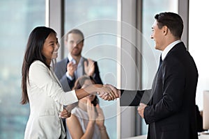 Company CEO handshake female employee greeting with achievement