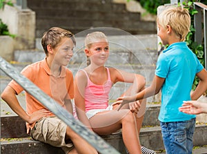 Company of children are communicating on walk