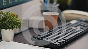 Company files and coffee on table in accounting office, close up