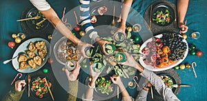 Company of friends or family gathering for Christmas dinner