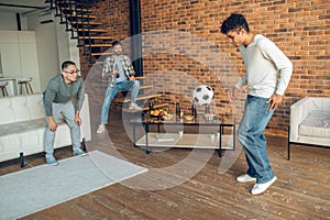 Company of friends involved in an indoor sports game