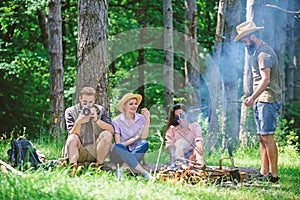 Company hikers relaxing at picnic forest background. Spend great time on weekend. Take a break to have snack. Company