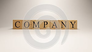 Company name was created from wooden letter cubes. Economics and Finance.