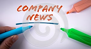 Company News. Text and colored markers on a white background