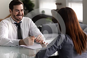 Company owner and female applicant communicating during job interview