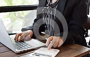 The company`s female accountant is checking the company`s financial account.