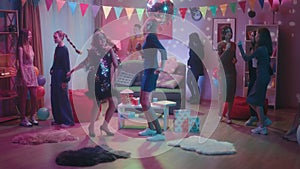 A company of teenagers dance incendiary at a house party, except for one informal girl. The interior of the room is