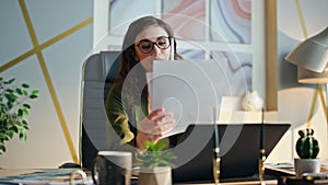 Company worker speaking mobile phone at office table closeup. Employee calling