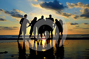 company workers after team building meeting, silhouette near seaside. AI Generated