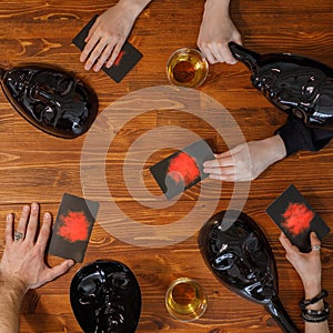 A company of young people is playing a board game. Friendship and fun concept. Among friends and they are in a good mood.