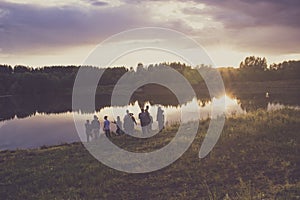 The company of young people resting on the river photo