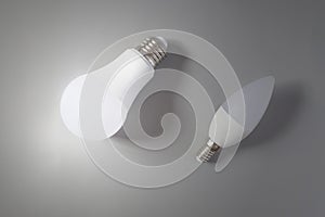 A comparative large and small light bulb, small and medium business.