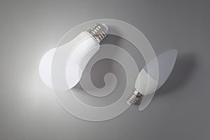 A comparative large and small light bulb, small and medium business. photo