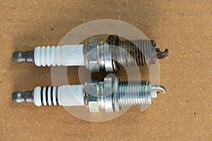 Compare new and old spark plugs.