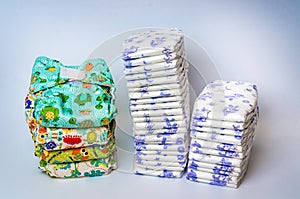Compare reusable cloth diapers with pile of disposable diapers