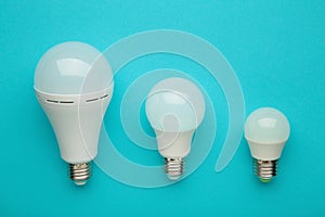 Comparison of different light bulbs on blue background