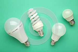 Comparison of different light bulbs on mint background