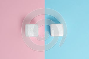 Two Objects Arranged Facing Inward Outward On a Separated Coloured Background