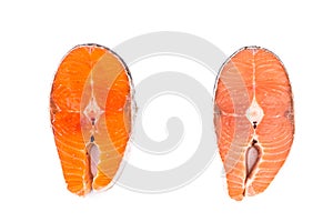 Comparison between wild and farmed salmon blocks on white backgr