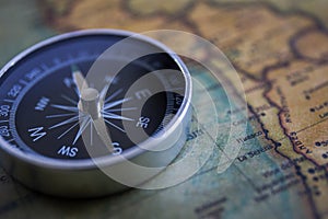 Compass on the background, old world map, vintage style, geo-navigation concept