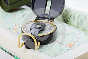 Compass and binoculars on map closeup