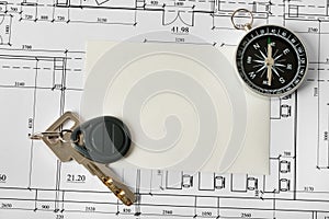 Compass with blueprints and key