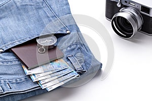 Compass, camera, passport and money prepared for travel