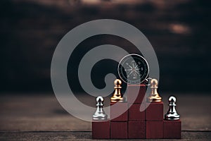 compass and chess piece on cube wood for ideas, challenge, leadership, strategy, business, success or abstract