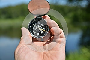 Compass in hand.