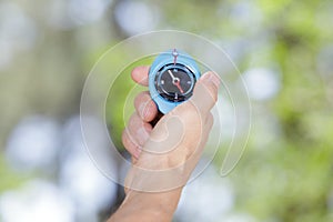 compass in hand traveller in mountains