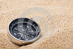 Compass on the hot sand