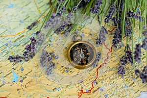 Compass and lavender flowers on the map of Bulgaria. Mountain route planning