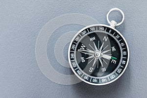 Compass lying on a blue office desk. Concept for business and creativity