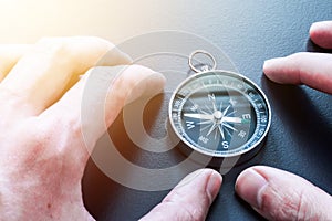 Compass lying on a blue office desk. Concept for business and creativity