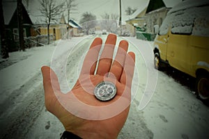 Compass in man`s hand