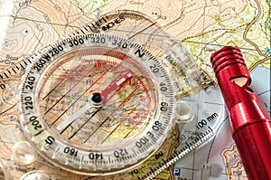 Compass on Map and Rescue Whistle