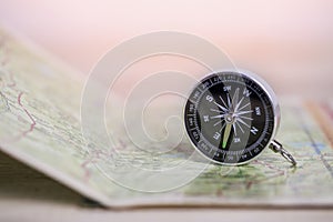 Compass on map. Travel and adventure Concept.