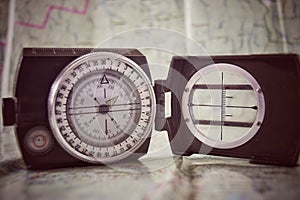 Compass, maps, goal - travel close-up