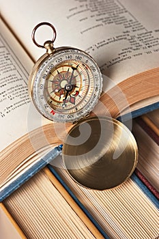 compass and old books