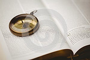 Compass on open bible