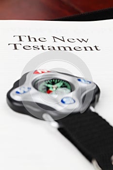 Compass on open New Testament