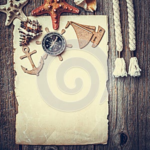 Compass and a piece of old paper as a still life of a traveler or navigator