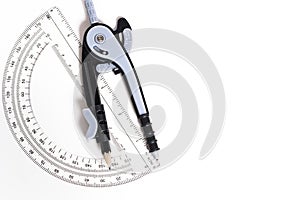 Compass and protractor on a white background