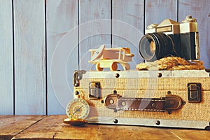 Compass, rope, old camera and toy plane. explorer concept