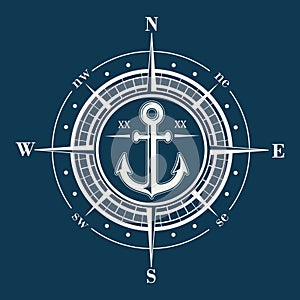 Compass rose or windrose emblem with anchor