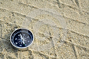 Compass on sand track