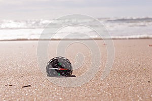 Compass on the sea sand at the beach